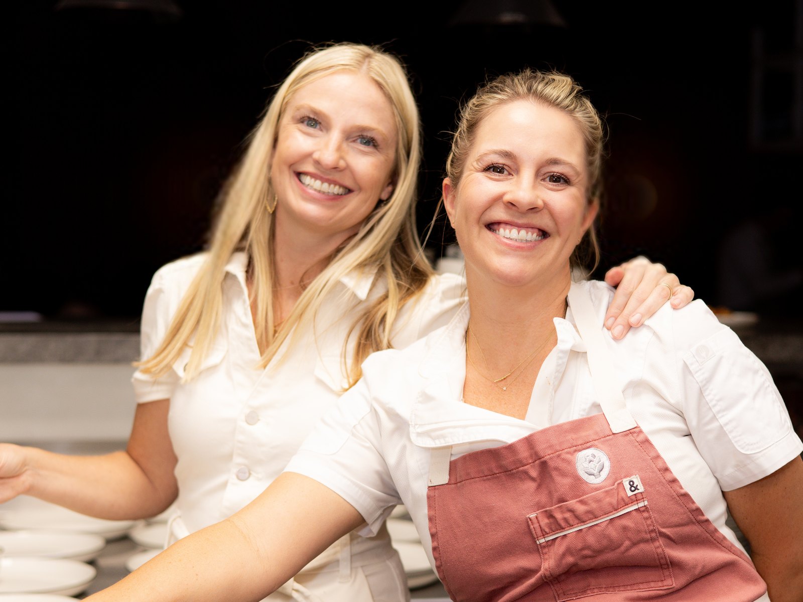Amelia's founders April and Stacey together behind the pass