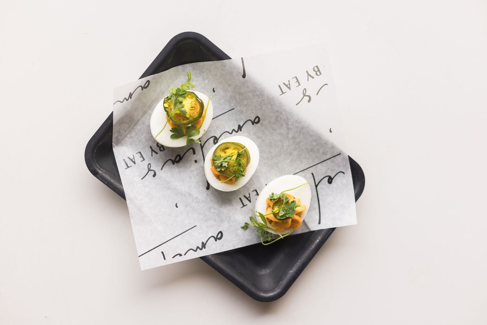 Amelia's Spicy Deviled Eggs — Calabrian chili, candied jalapeño