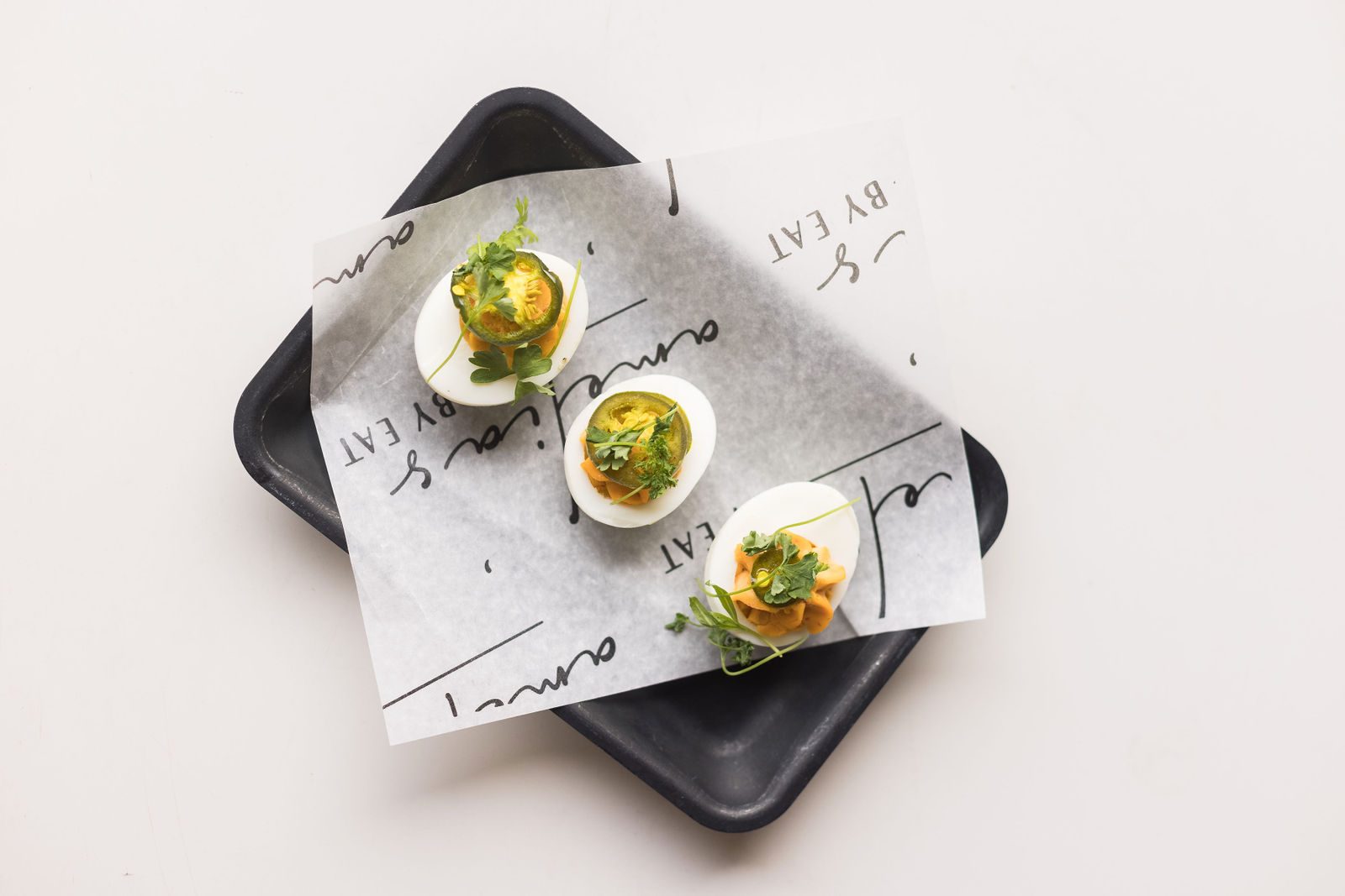 Amelia's Spicy Deviled Eggs — Calabrian chili, candied jalapeño