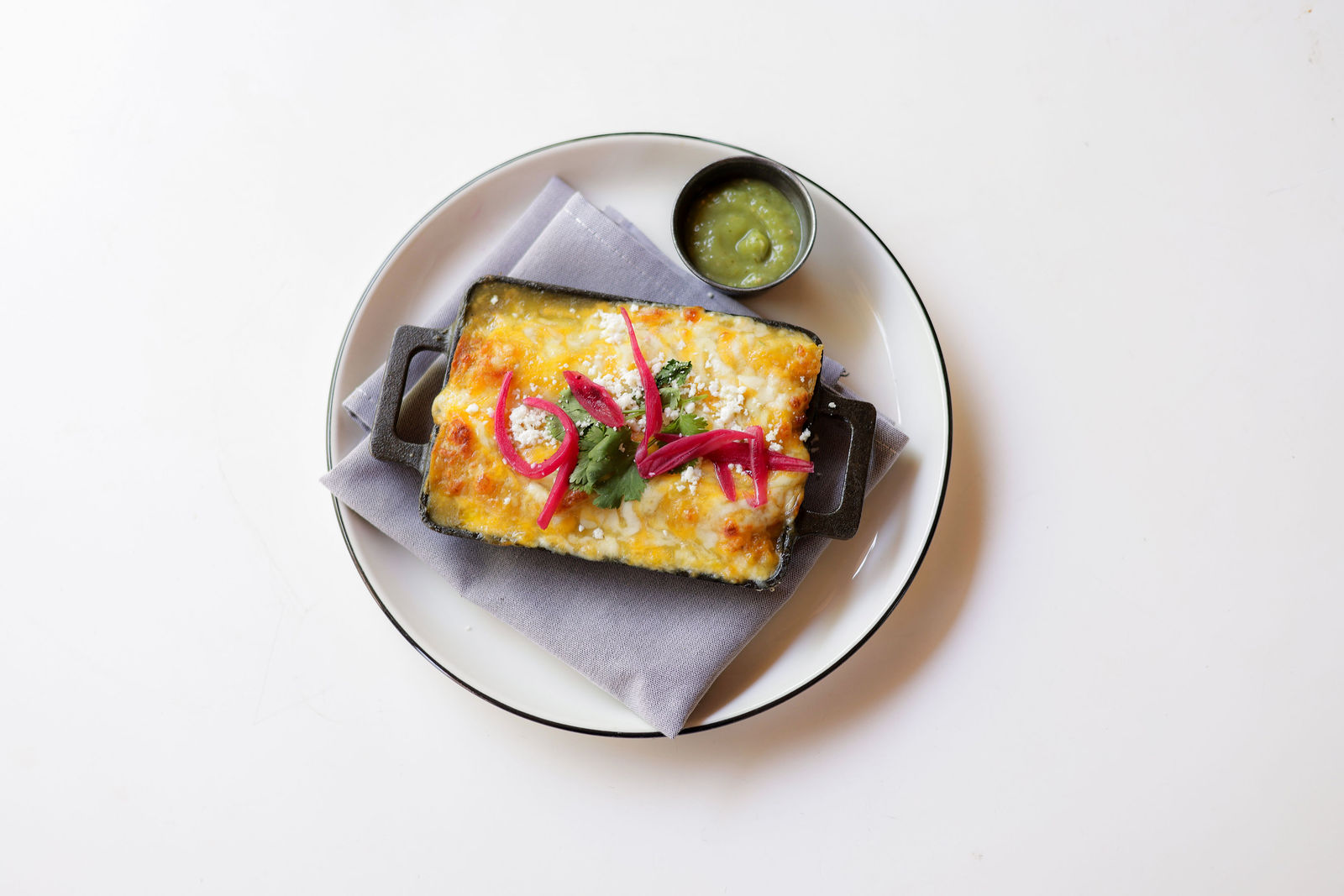 Stacey's Famous Chicken Rice Enchilada — Creamy chicken + rice, hatch green chili sauce, housemade organic corn tortilla